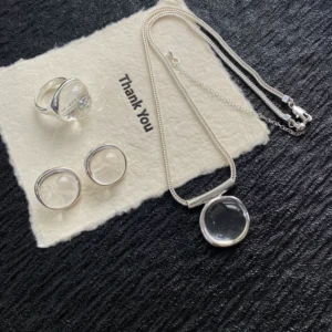 Niche design white crystal pendant necklace earrings womens summer light luxury highend temperament versatile clavicle sweater chain