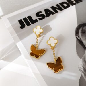p168 New lucky white fritillary tiger eye stone double flower earringsWhite FritillaryTiger Eye Butterfly Double Flower Earrings Thick gold plating natural motherofpearl and natural tiger eye stone each piece has its own luster and unique color and the color changes with the light The textures are all formed naturally by natural stoneGold white motherofpearl and tiger eye stone a beautiful color combination looks very elegant when worn daily